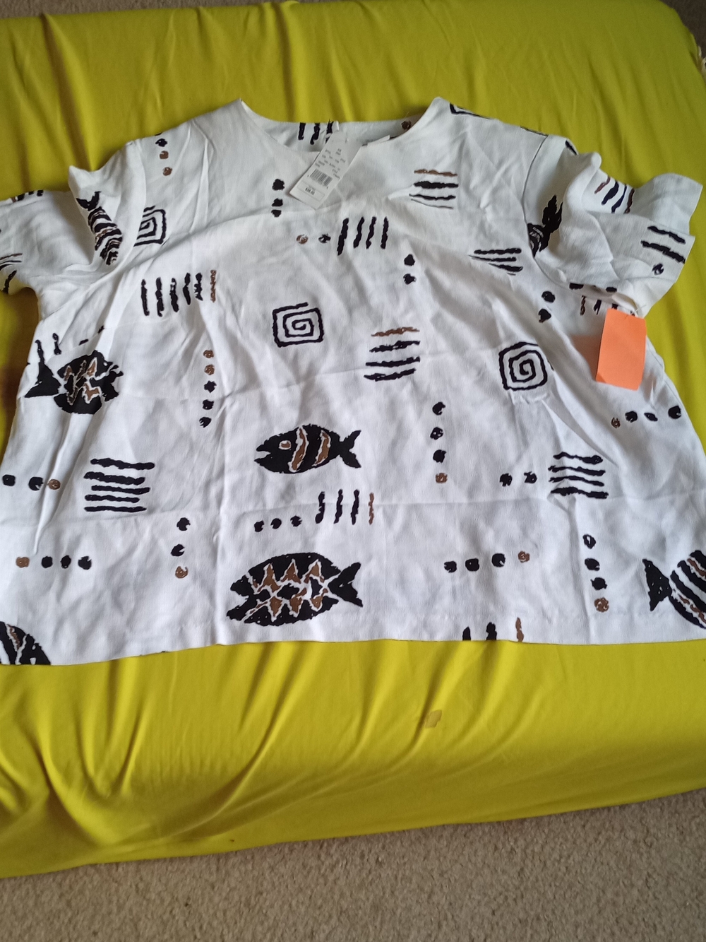 White cotton blouse In  a black and brown abstract tribal print design. NWT